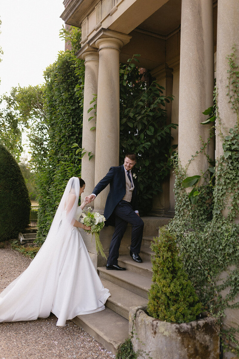 Bride laughing with her bridesmaids at wedding in Orangery Settrington