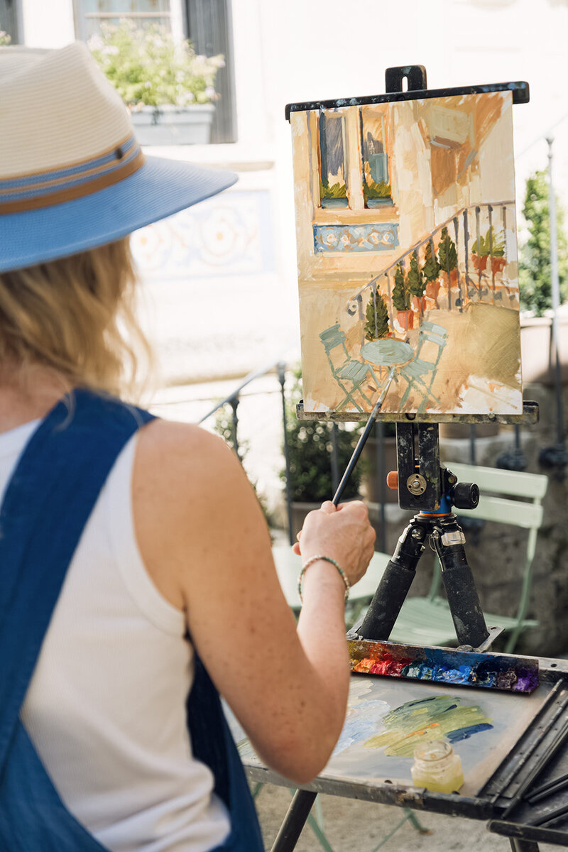 Clare Bowen painting outdoors during a French art retreat