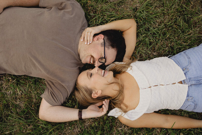 Couple laying in grass