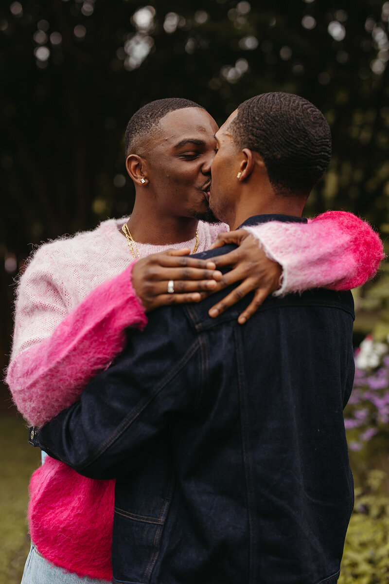 couple kissing after surprise proposal