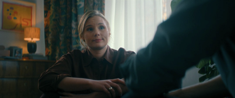 A close-up shot capturing subtle emotional tension between two characters.