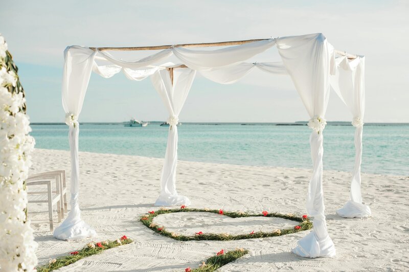 Destination wedding altar on sandy beach