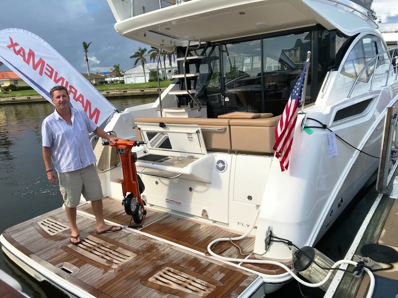 Boat owner with Copper Go-Bike M1 on his boat deck