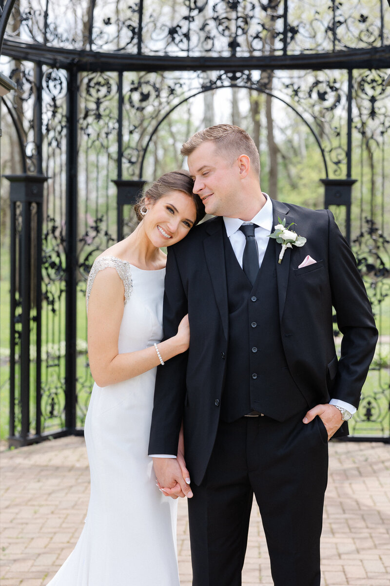 bride resting head on grooms shoulder