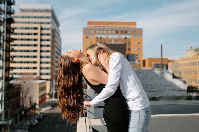 engaged couple kissing
