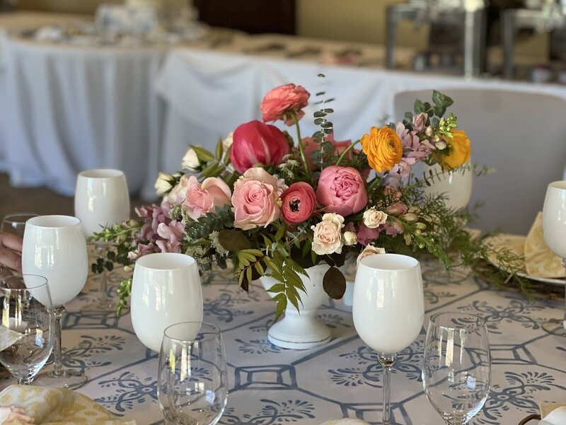 Photo of a boquet of flowers on a desk.