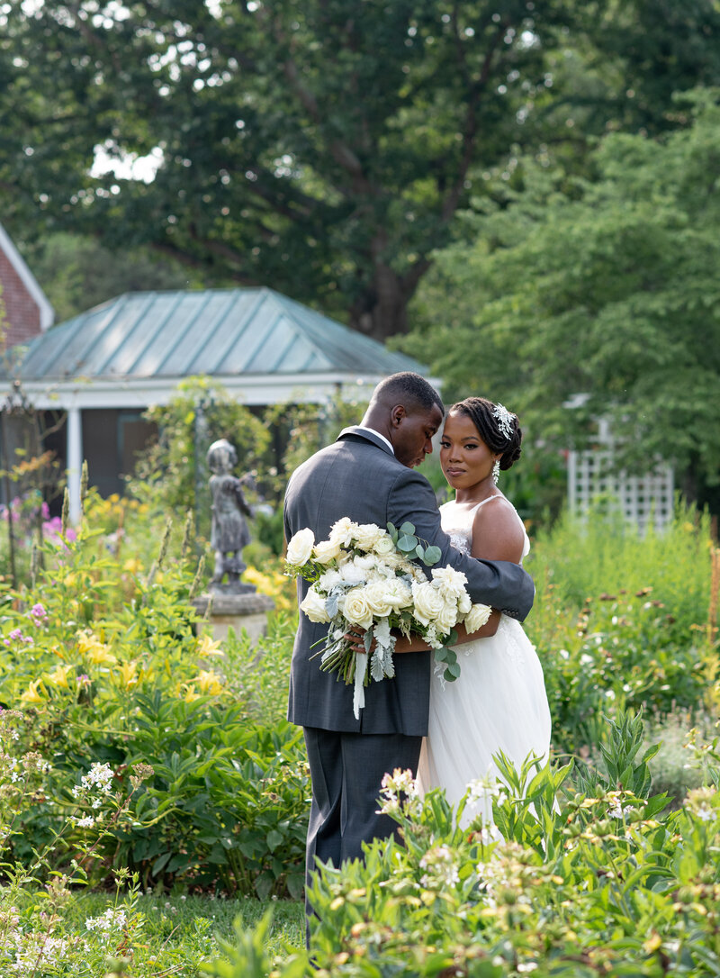 bride and groom posed in Northern Virginia garden