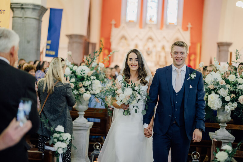bride-and-groom-walk-down-aisle-in-church-in-thomastown