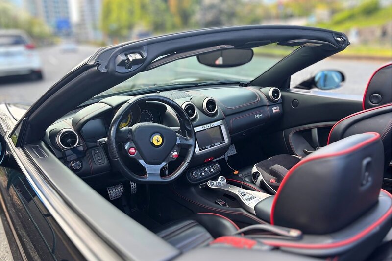Interior view of the Ferrari California with premium leather seats and racing accents, showcasing the luxury and performance of Tokyo Luxe Drive’s fleet.