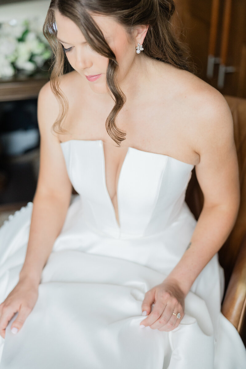 A portrait of a bride looking down at the Ben in West Palm Beach.