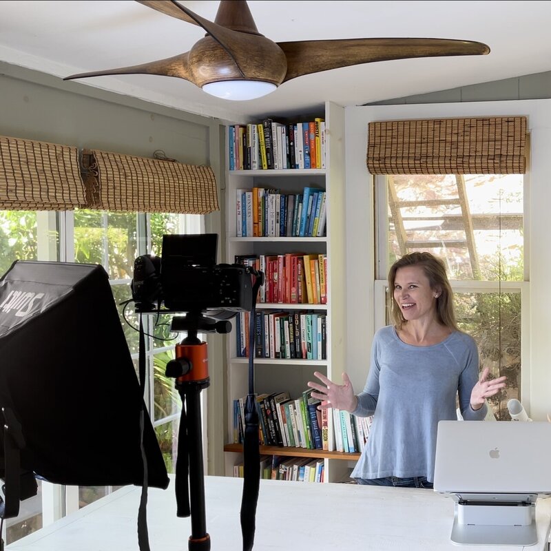 woman doing fb live from home camera studio set up work from home