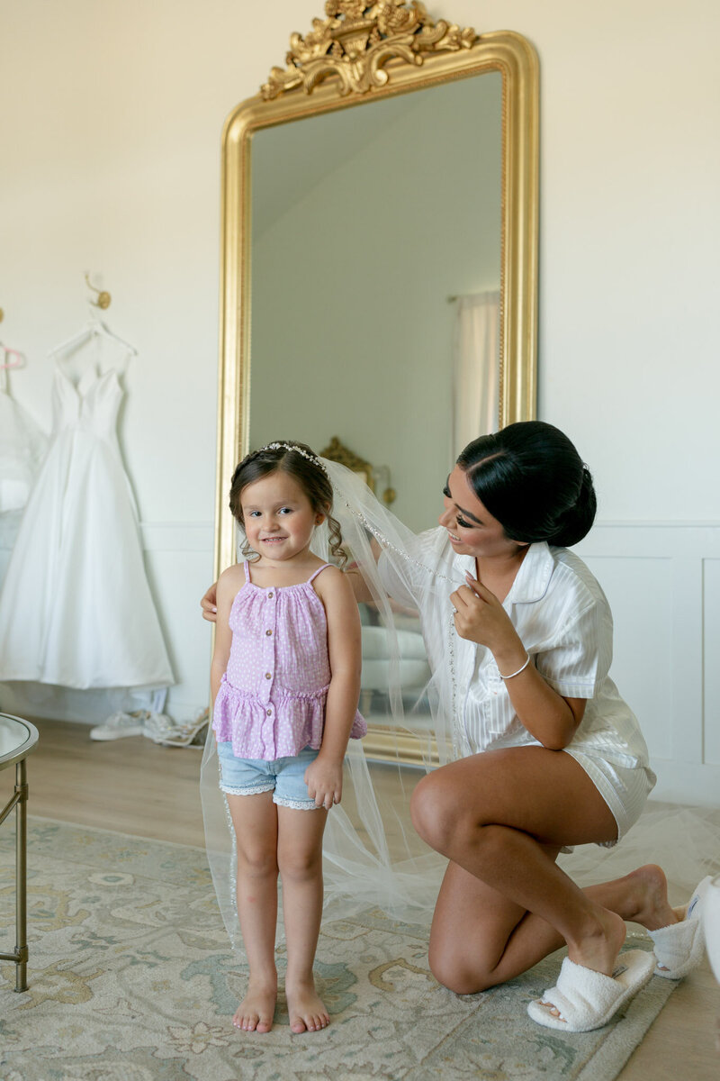 bride and flower girl getting ready
