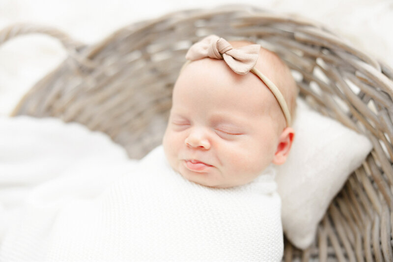 Baby girl sleeping in basket by Alexandria VA newborn photographer