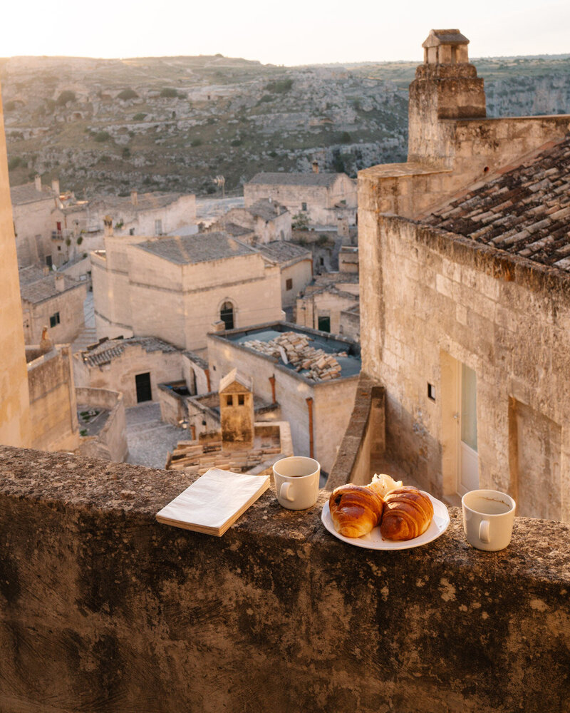 Hotel breakfast overlooking traditional village of Matera Italy