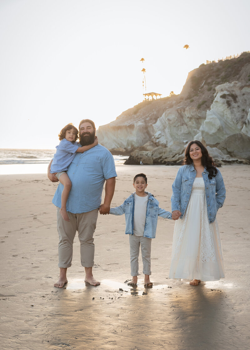 Family Photoshoot in Pismo Beach on the Central Coast with family candid walk holding hands