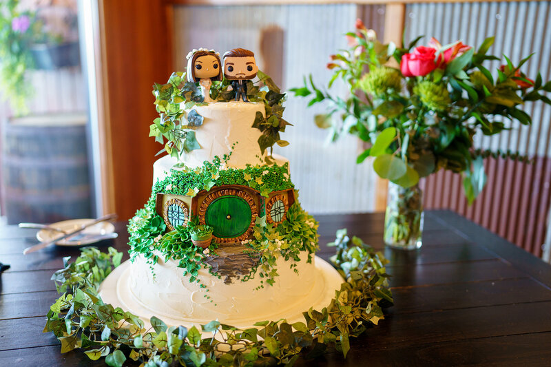 Hobbit-inspired wedding cake decorated with Lord of the Rings details during a themed wedding at Christies of Genesee.
