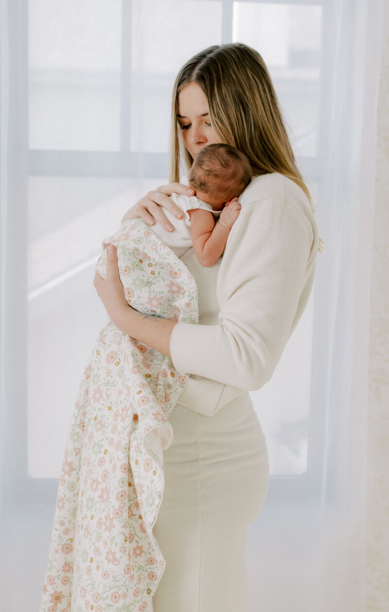 mom with newborn in studio photography