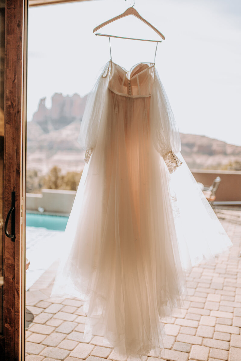 boho wedding dress with sleeves and lace at cathedral rock in sedona