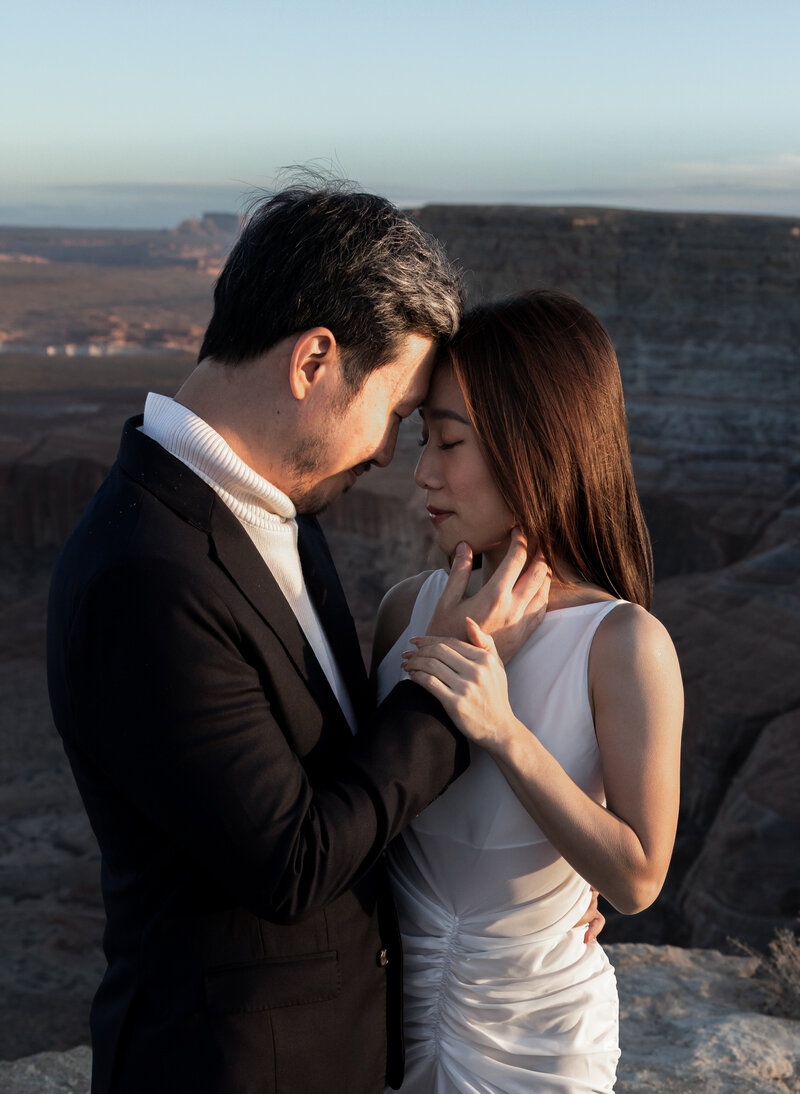An engagement couple sharing a kiss in Page, Arizona. Photo taken by Kollar Photography. Arizona Elopement Photographer