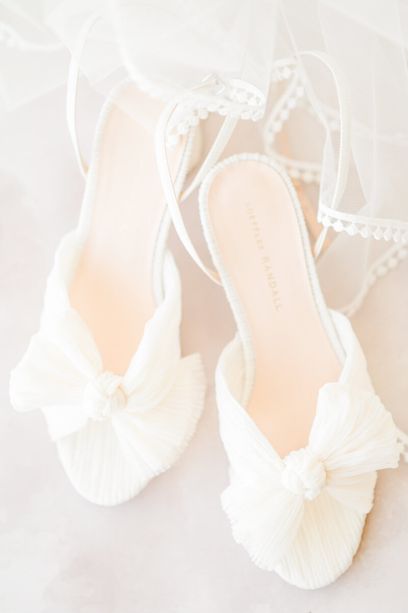 A pair of white Loeffler Randall bridal heels.