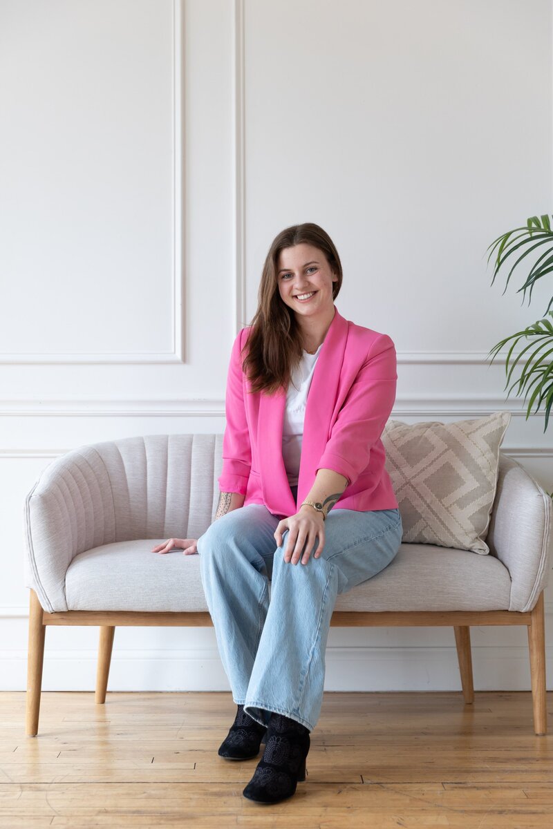 Website designer in the Twin Cities posing for a brand photo shoot.