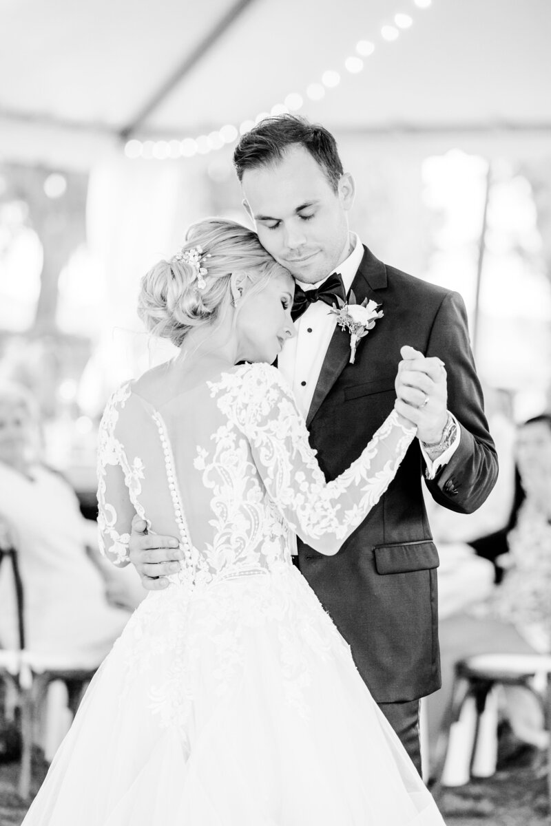 romantic photo of bride and groom slow dancing