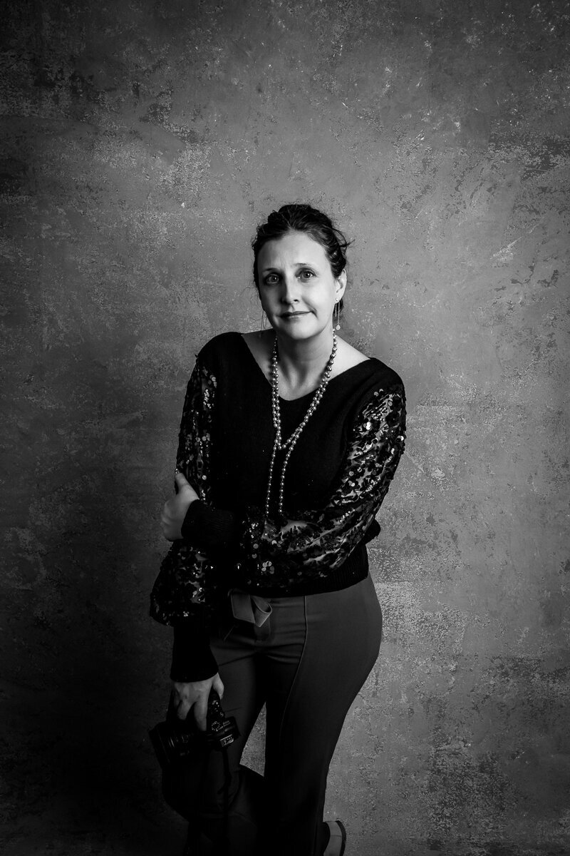 Heidi iliff working contemplative in this black-and-white image