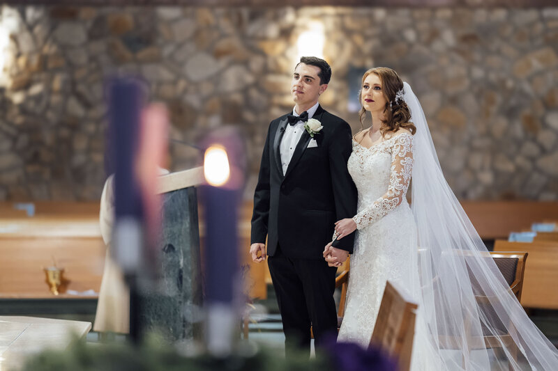 St. Frances Cabrini Church Wedding | Bride and Groom Holding Hands During Ceremony | Fairless Hills, Pennsylvania