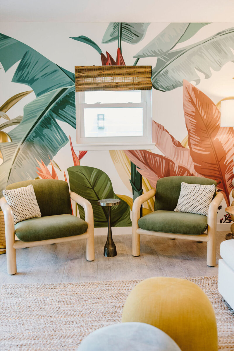 green chair with floral wallpaper