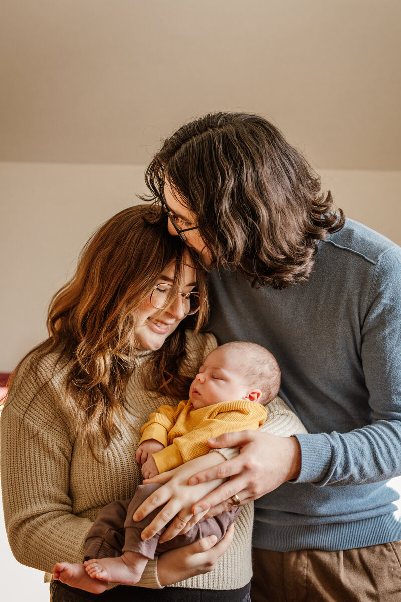 New parents at home with son 