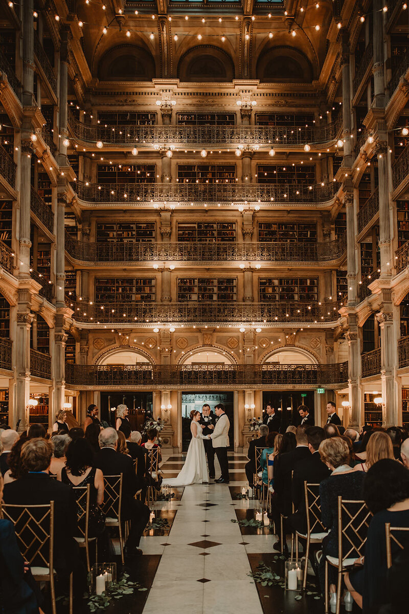 View down the aisle of a couple saying their vows on their wedding day 