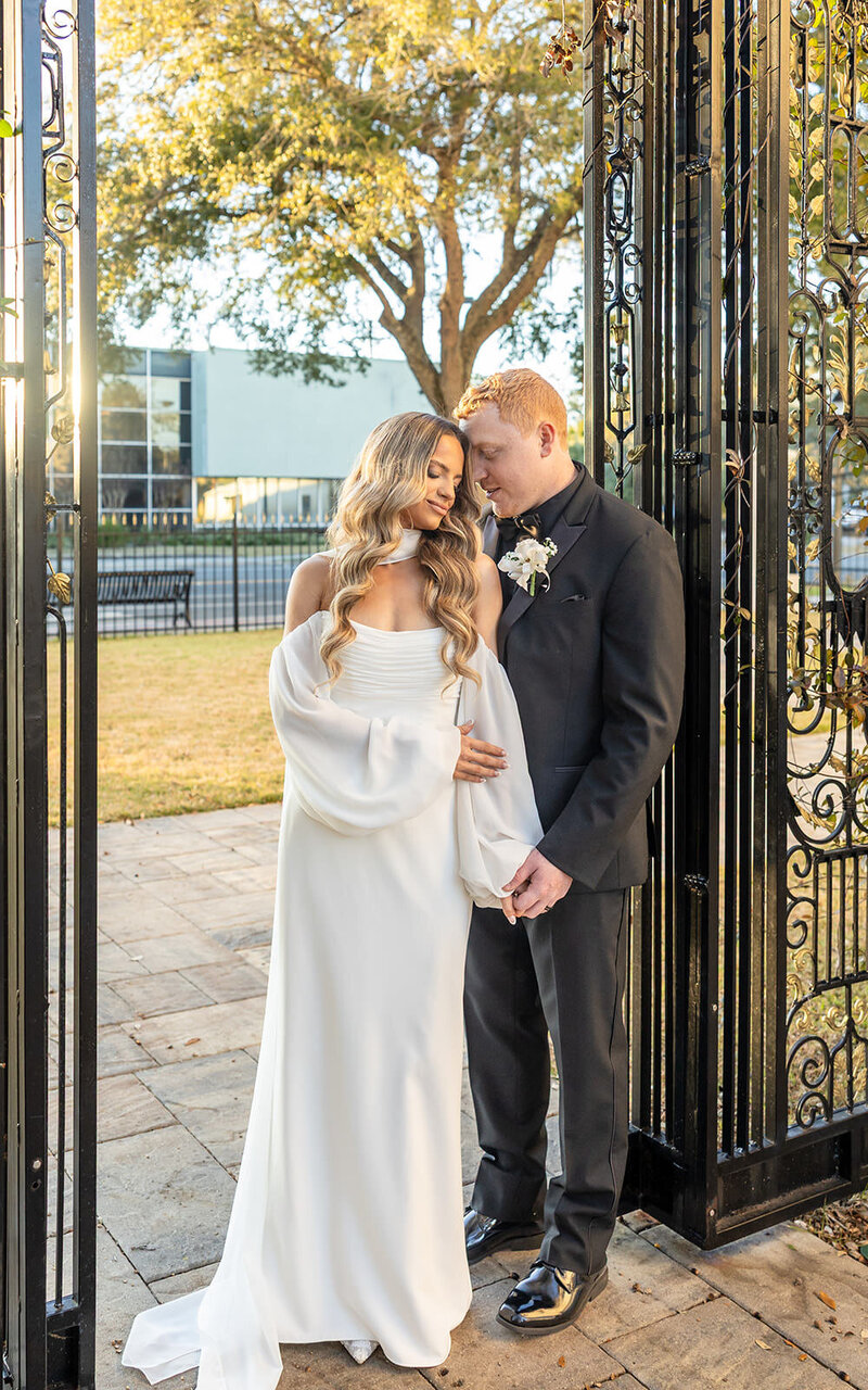 Bridal Jacksonville wedding couple next to an iron gate 