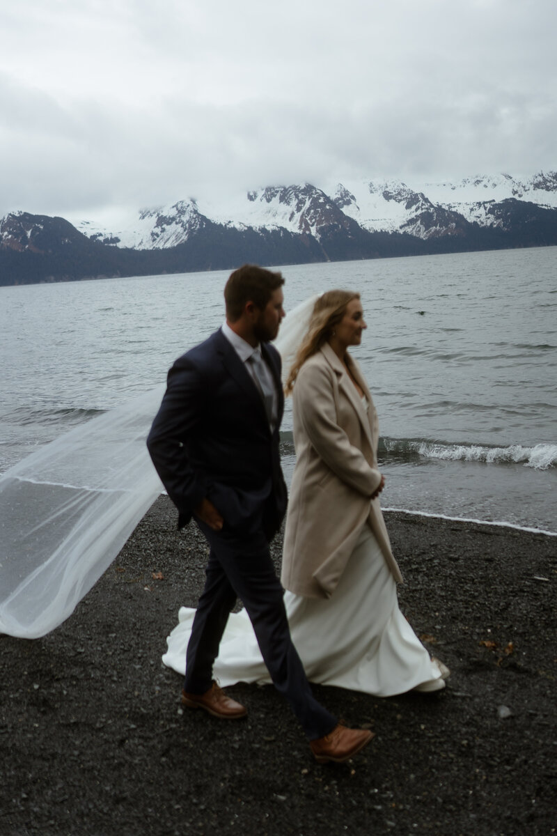 couple walking on beach for Seward Alaska Elopement