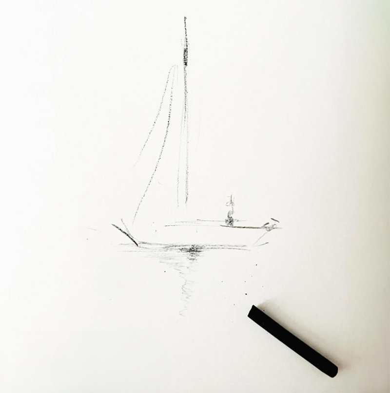 Minimalist sailboat sketch with charcoal on white paper, beside a drawing tool.