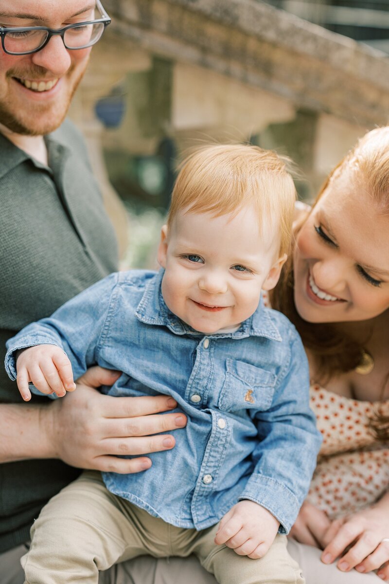 family of 3 snuggling by philadelphia family photographer