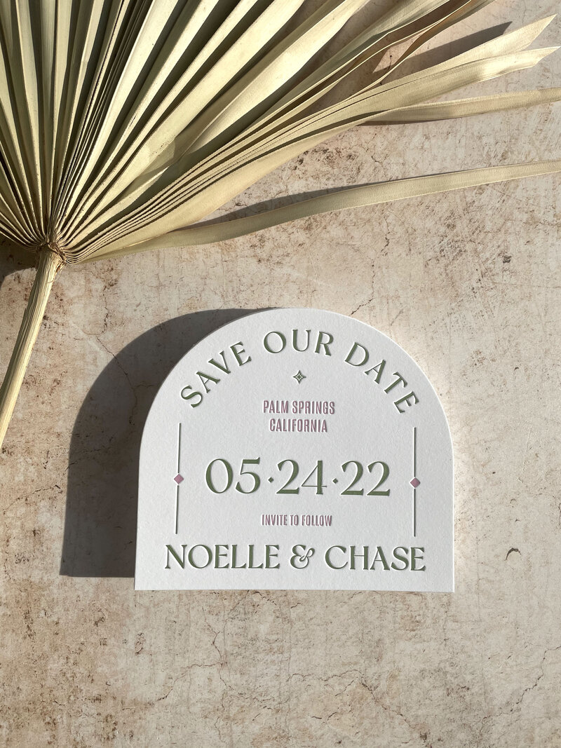 arch pink and green save the date for palm spring wedding
