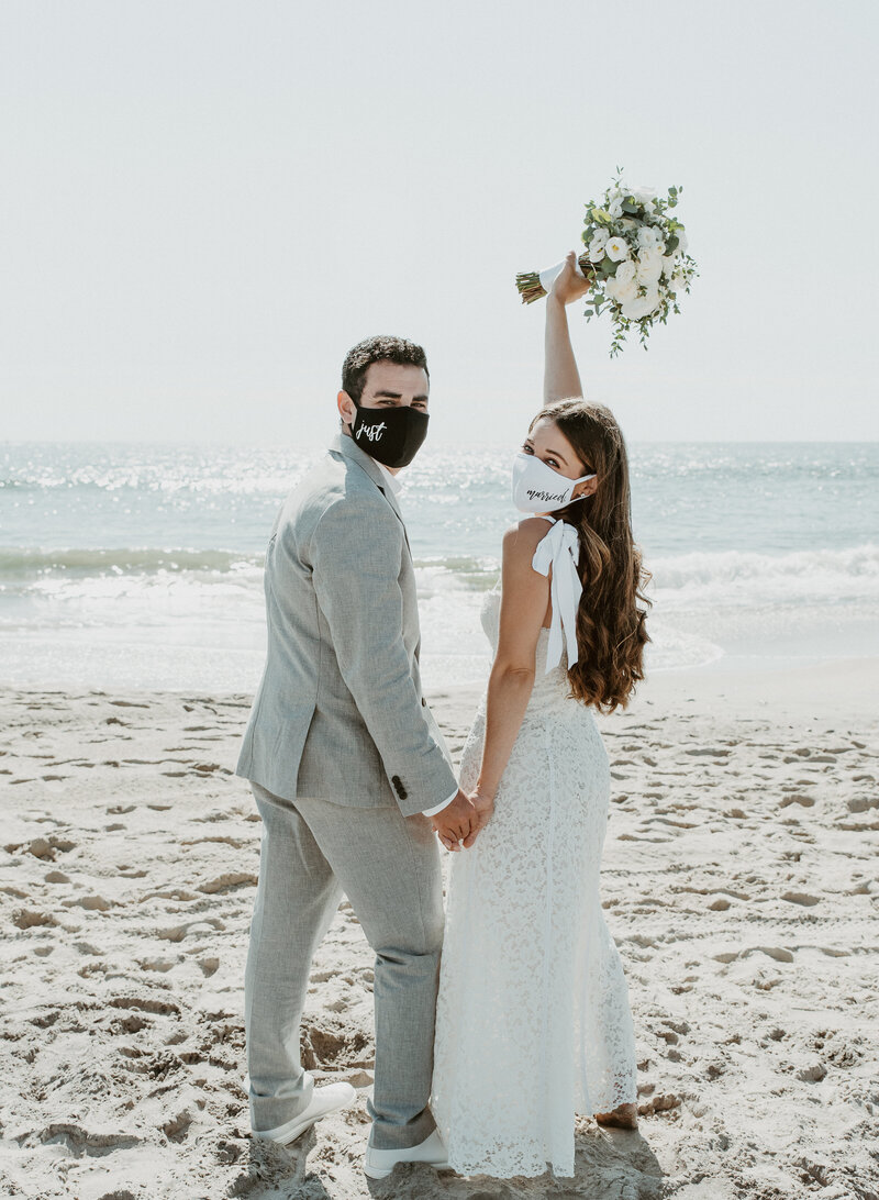 Bride and groom with their masks on at Carlsbad wedding