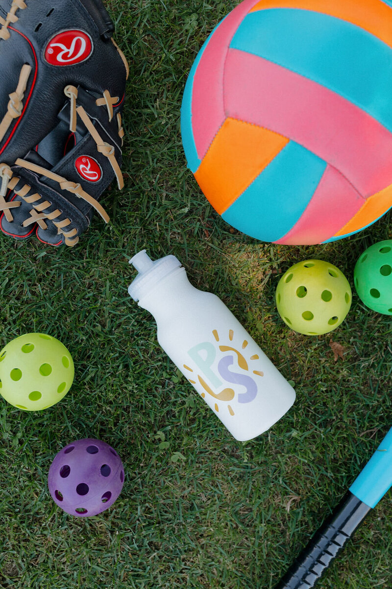 water bottle and pickleball balls