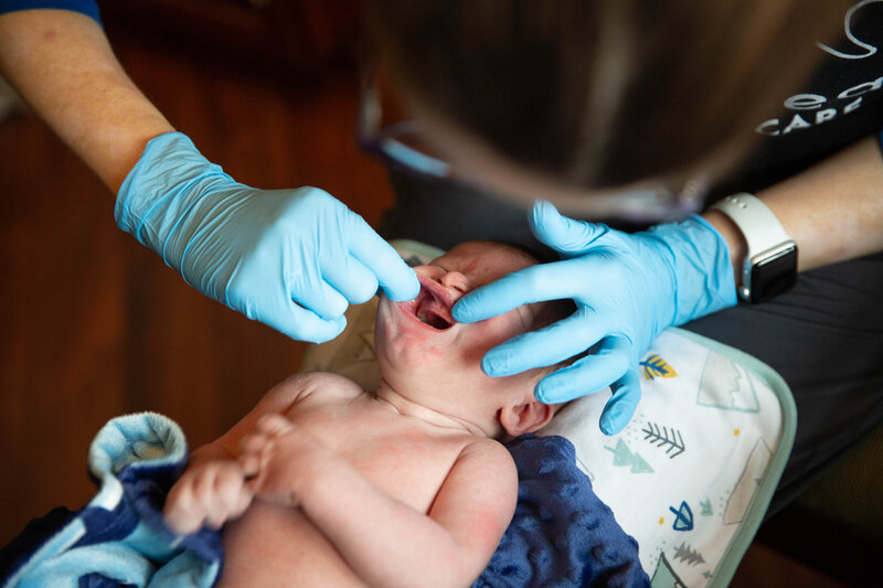 Baby being checked for tongue ties