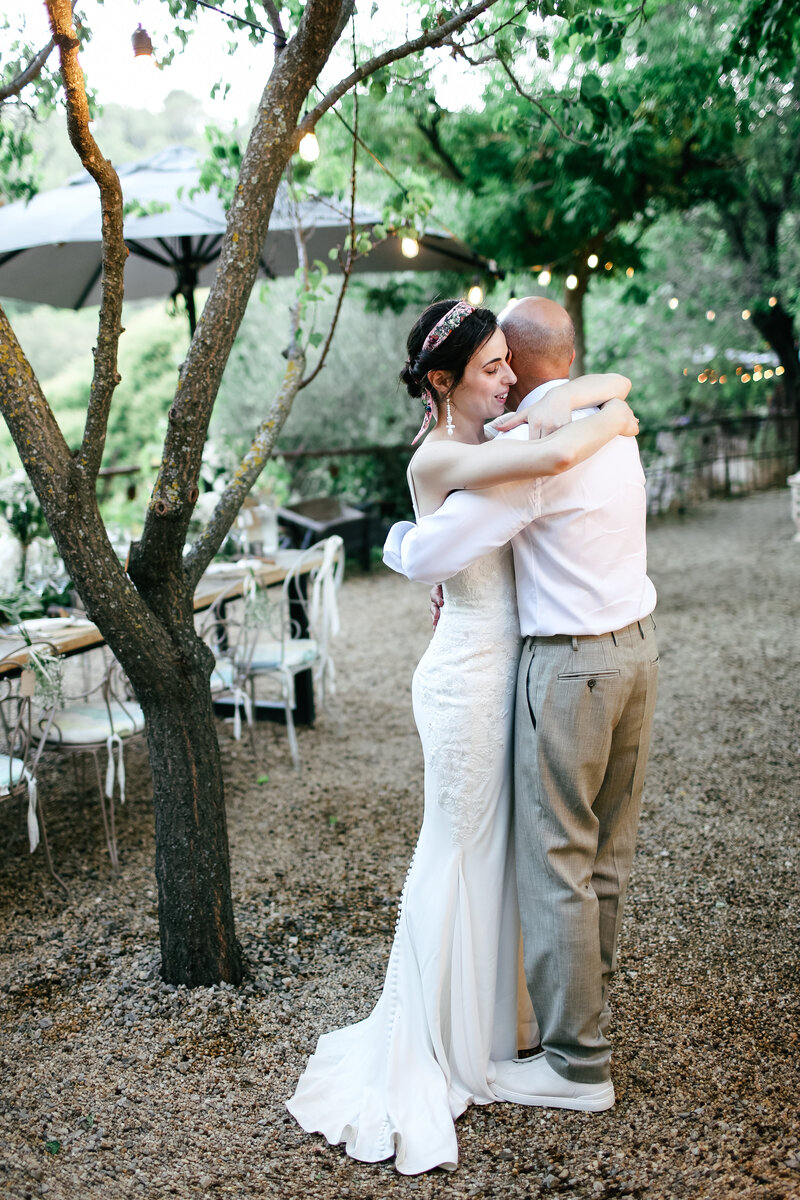 bride-and-groom-embrace-at-luxury-wedding-at-lou-calen-cotignac