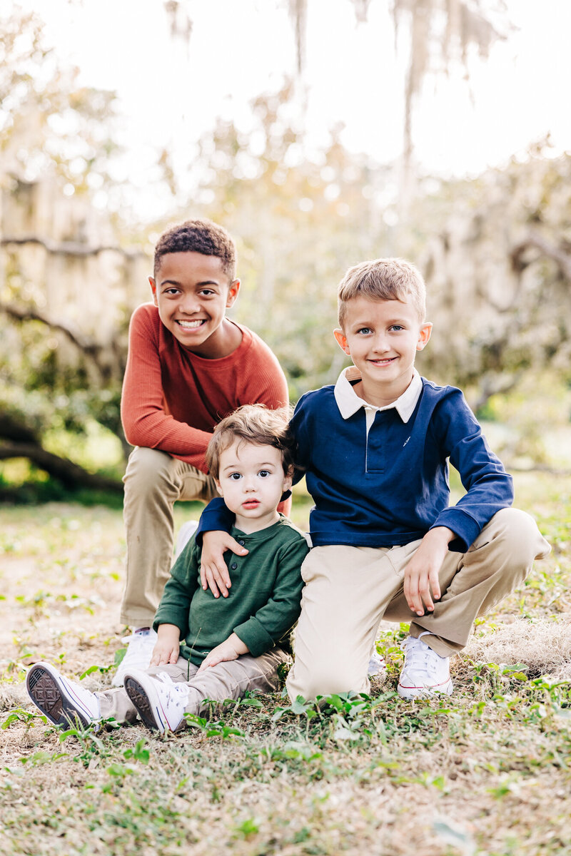 Smiling family captured on the tiny beach at USF St. Pete during holiday session.