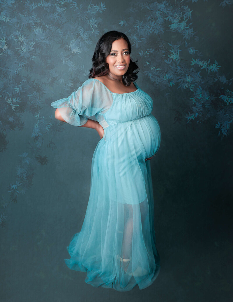 Posed maternity woman at our Rochester, Ny studio.