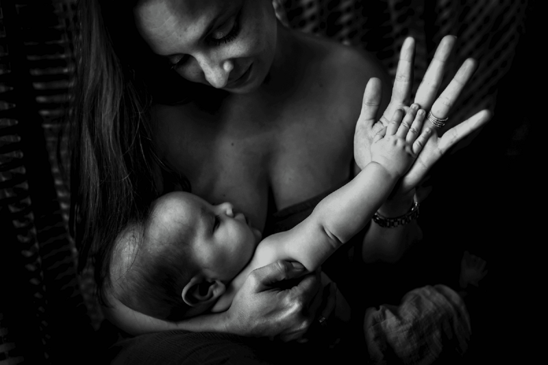 Mother and new baby sharing a moment of embrace