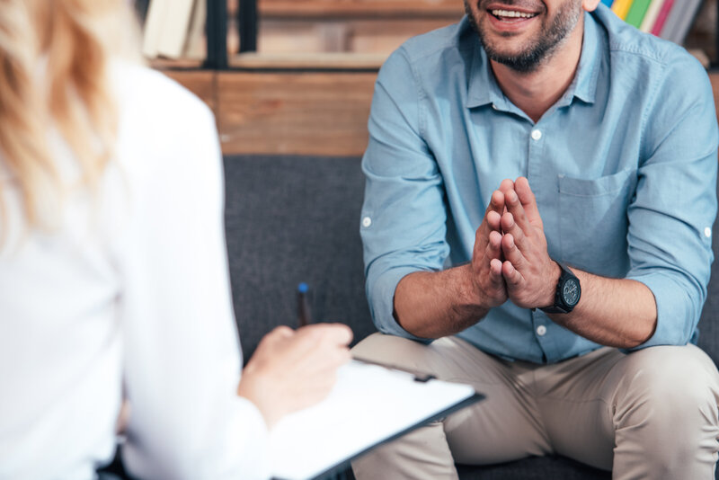 Therapist and client sitting in conversation during a counseling session representing Rooted Renewal therapy for emotional support before and after bariatric surgery at Rooted & Nourished Psychotherapy