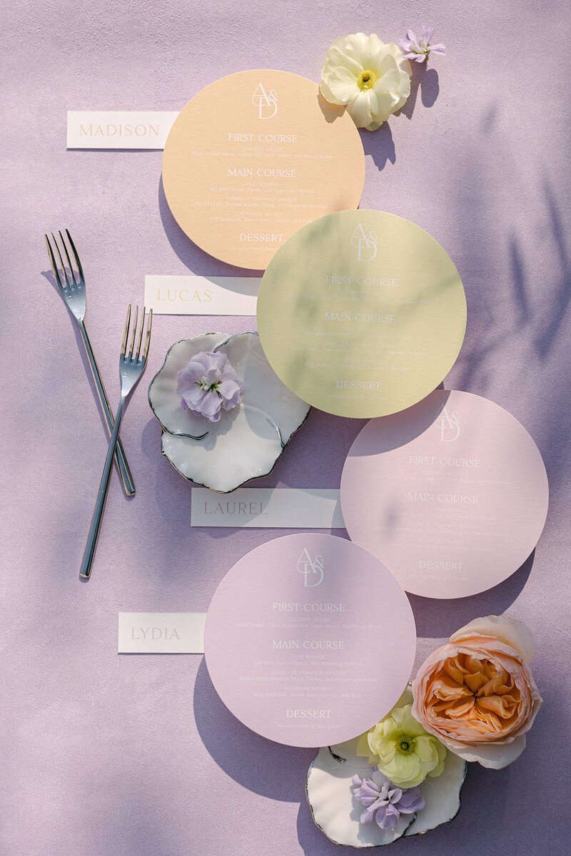 Lavender suede styling mat with delicate wedding paper and soft florals