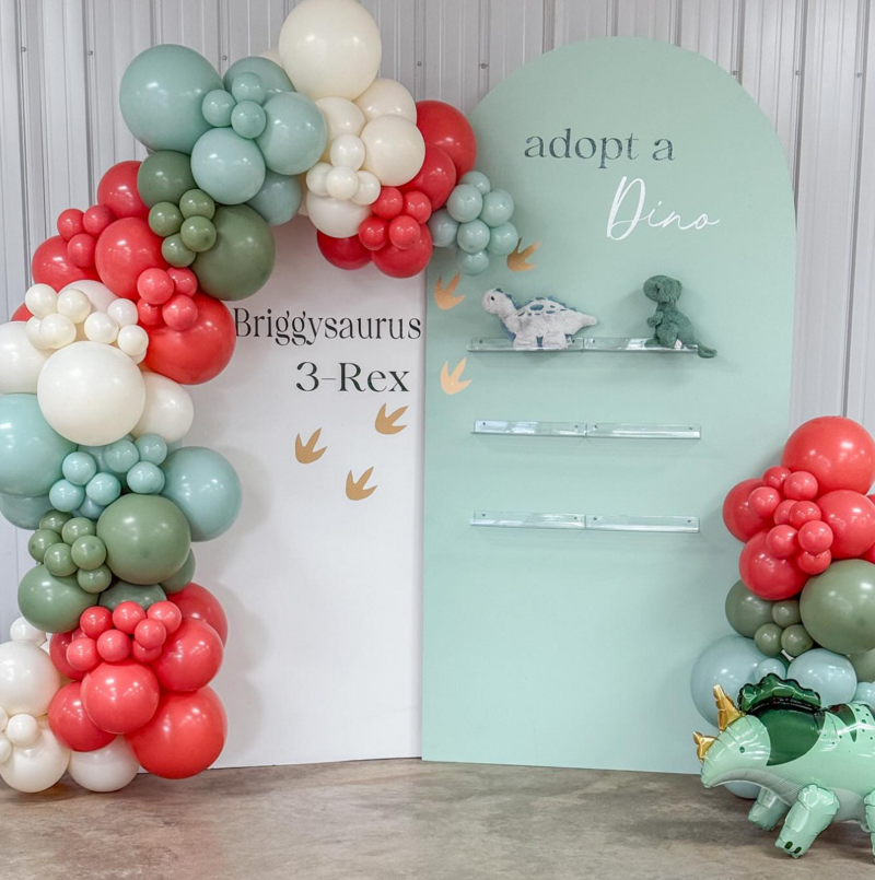 cute dinosaur themed birthday party ideas with balloons and backdrop