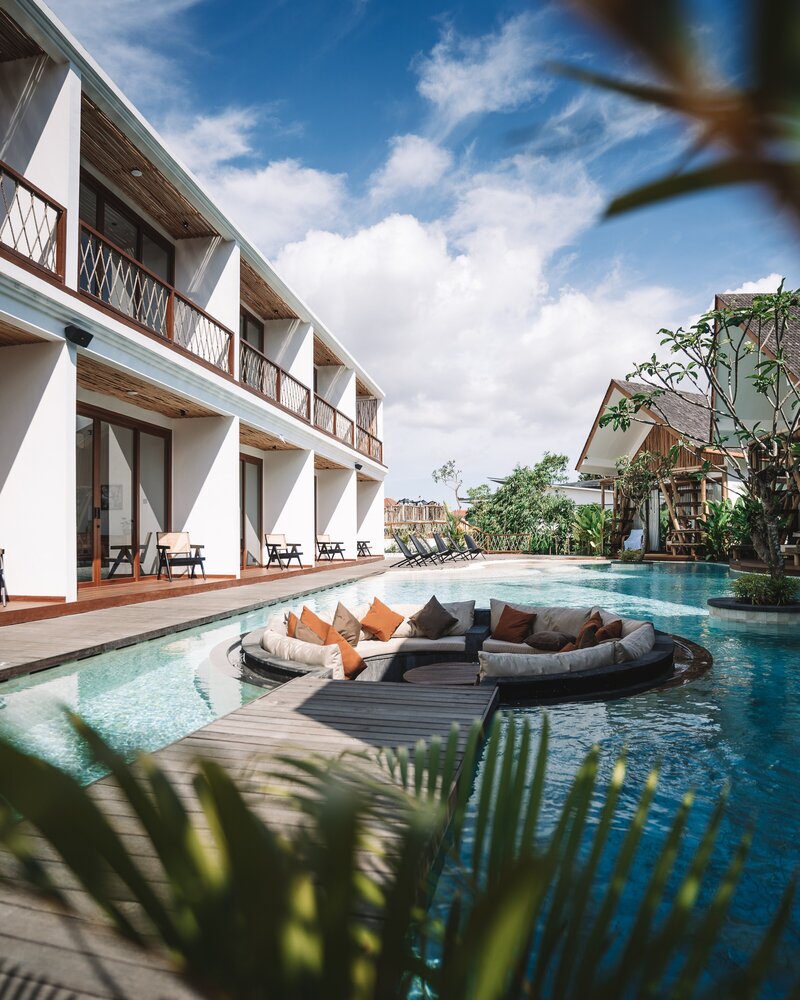 a pool sitting area at a luxury resort