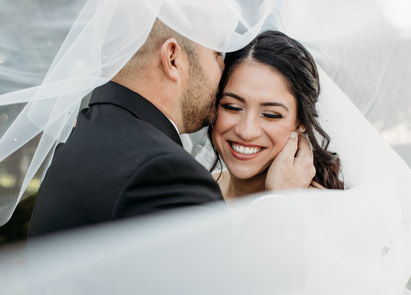 Bride and groom veil sunset photos