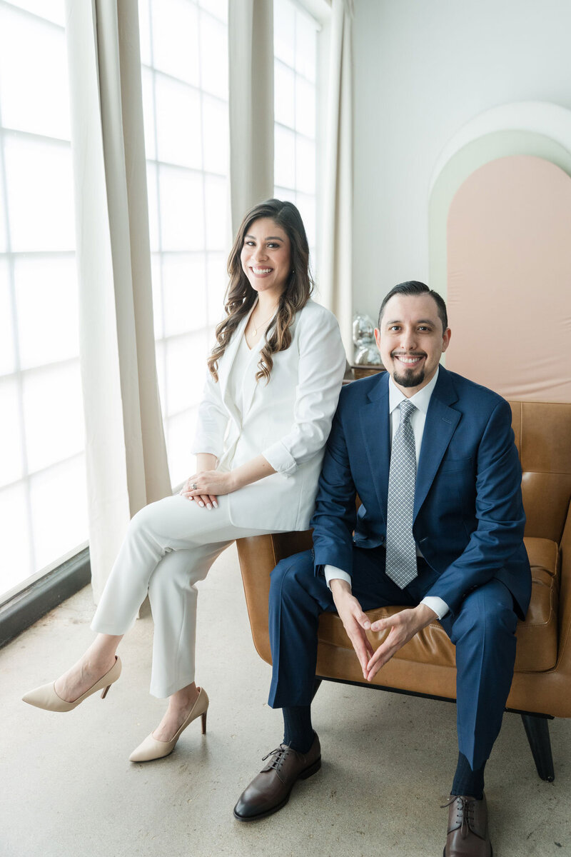 The CPA experts at Romo CPA Tax + Advisory sit in their Dallas office, professionally dressed in white and blue, serving entrepreneur clients with strategic tax support.