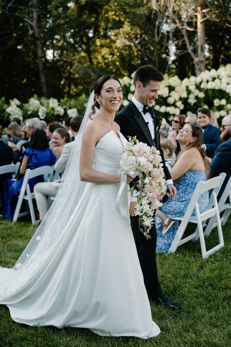 bride and groom walking down aisle